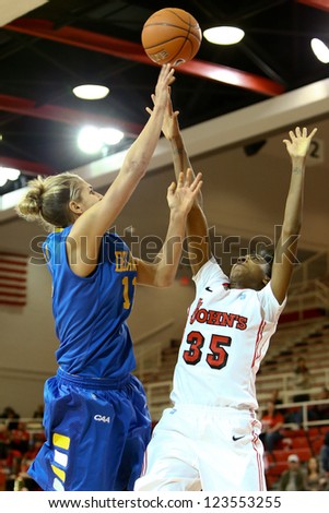 JAMAICA, NY-JAN 2: Delaware Blue Hens guard Elena Delle Donne (11) shoots over St. John\'s Red Storm guard Shenneika Smith (35) at Carnesecca Arena on January 2, 2013 in Jamaica, Queens, New York.