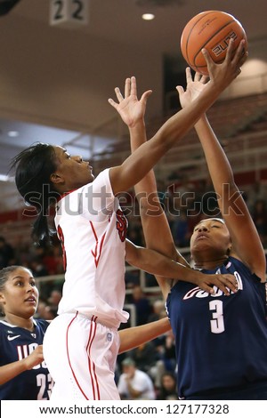 JAMAICA-FEB 2: St. John\'s Red Storm guard Aliyyah Handford (3) is defended by Connecticut Huskies forward Morgan Tuck (3) defends at Carnesecca Arena on February 2, 2013 in Jamaica, New York.