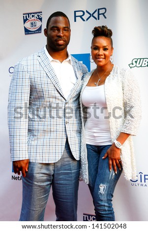 NEW YORK-MAY 30: New York Giants player Justin Tuck and actress Vivica A. Fox attend the 5th annual Tuck\'s Celebrity Billiards Tournament at Slate NYC on May 30, 2013 in New York City.