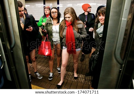 New York-Jan 12: A Participant In The 13th Annual International \'No Pants Subway Ride\' Waits For The Uptown 6 Train At Bleecker Street On January 12, 2014 In New York City.