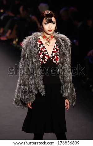 NEW YORK-FEB 12: A model walks the runway at the Anna Sui fashion show during Mercedes-Benz Fashion Week Fall 2014 at the Theatre at Lincoln Center on February 12, 2014 in New York City.