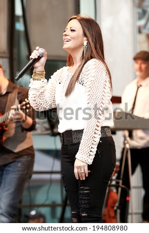 NEW YORK-MAY 23: Country music singer Sara Evans performs at Fox and Friends\' All-American Summer Concert Series at 48th Street and 6th Avenue on May 23, 2014 in New York City.