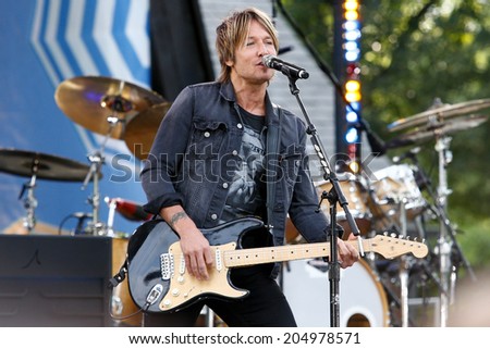 NEW YORK-JUL 11: Country music singer Keith Urban performs on ABC\'s \'Good Morning America\' concert series at Rumsey Playfield, Central Park on July 11, 2014 in New York City.