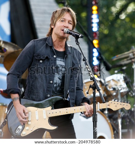 NEW YORK-JUL 11: Country music singer Keith Urban performs on ABC\'s \'Good Morning America\' concert series at Rumsey Playfield, Central Park on July 11, 2014 in New York City.