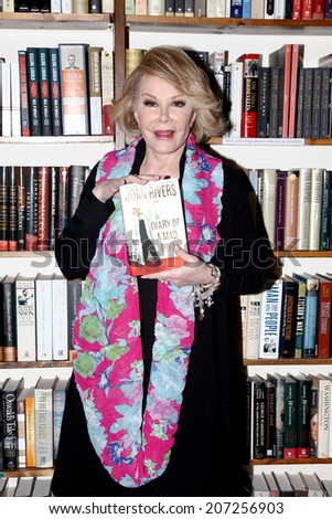 HUNTINGTON, NY-JUL 25: TV host Joan Rivers signs copies of her book, \