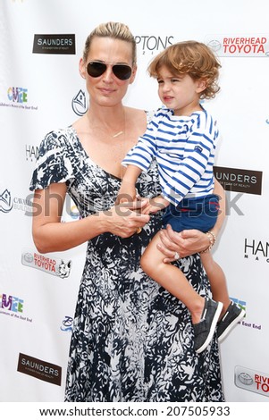 BRIDGEHAMPTON, NY-JUL 19: Actress Molly Sims (L) and son Brooks Stuber attend the 6th Annual Family Fair at the Children\'s Museum of the East End (CMEE) on July 19, 2014 in Bridgehampton, New York.