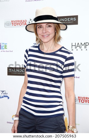 BRIDGEHAMPTON, NY-JUL 19: Actress Christa Miller attends the 6th Annual Family Fair at the Children\'s Museum of the East End (CMEE) on July 19, 2014 in Bridgehampton, New York.