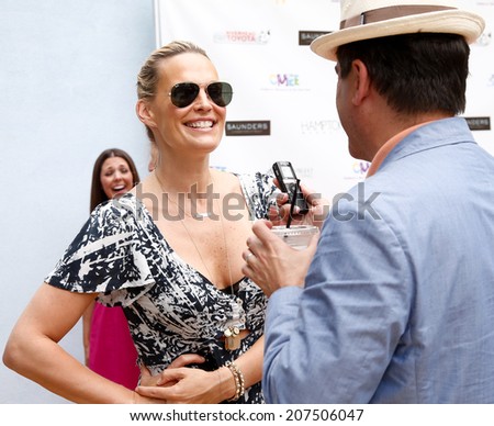 BRIDGEHAMPTON, NY-JUL 19: Actress Molly Sims attends the 6th Annual Family Fair at the Children\'s Museum of the East End (CMEE) on July 19, 2014 in Bridgehampton, New York.
