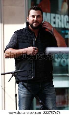 NEW YORK-AUG 22: Country music singer Tyler Farr performs at Fox and Friends\' All-American Summer Concert Series on the corner of 48th Street and 6th Avenue on August 22, 2014 in New York City.