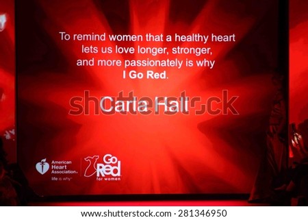 NEW YORK-FEB 12: Chef Carla Hall wears Evgenia at Go Red for Women-The Heart Truth Red Dress Collection at Mercedes-Benz Fashion Week at Lincoln Center on February 12, 2015 in New York City.