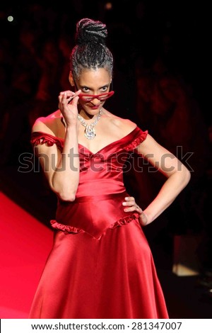 NEW YORK-FEB 12: Chef Carla Hall wears Evgenia at Go Red for Women-The Heart Truth Red Dress Collection at Mercedes-Benz Fashion Week at Lincoln Center on February 12, 2014 in New York City.