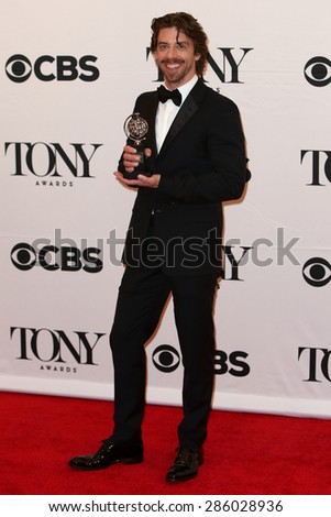 NEW YORK-JUN 7: Actor Christian Borle holds the trophy at the American Theatre Wing's 69th Annual Tony Awards at Radio City Music Hall on June 7, 2015 in New York City.