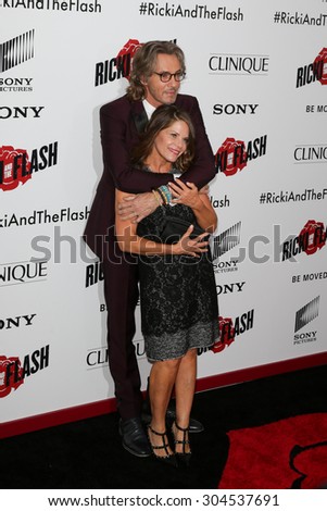 NEW YORK-AUG 3: Musician Rick Springfield and wife Barbara Porter attend the \'Ricki And The Flash\' New York premiere at AMC Lincoln Square Theater on August 3, 2015 in New York City.