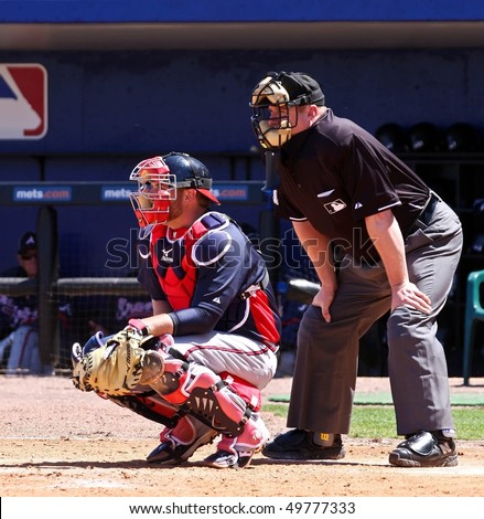 PORT ST. LUCIE, FLORIDA - MARCH 23: Atlanta Braves catcher Brian McCann sits behind home plate during the game against the New York Mets on March 23, 2010 in Port St. Lucie, Florida.