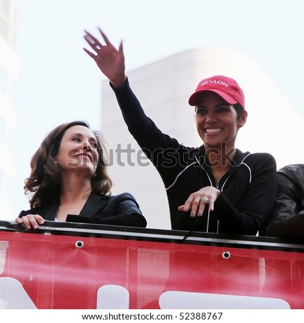 NEW YORK - MAY 1: Halle Berry (R) waves to the crowd at the 13th Annual Entertainment Industry Foundation Revlon Run/Walk for Women in Times Square on May 1, 2010 in New York City.