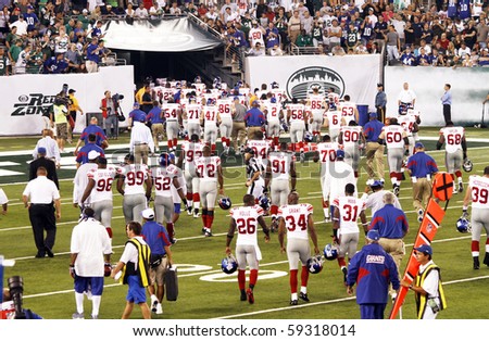 EAST RUTHERFORD, NJ - AUGUST 16: The New York Giants retreat to the locker room at halftime against  the New York Jets at MetLife stadium on August 16, 2010 in East Rutherford, New Jersey.
