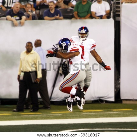 EAST RUTHERFORD, NJ - AUGUST 16: New York Giants wide receiver Victor Cruz and Jerome Johnson celebrate in the endzone at MetLife stadium on August 16, 2010 in East Rutherford, New Jersey.