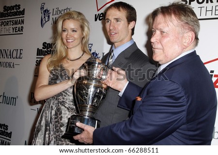 NEW YORK - NOVEMBER 30: Brittany Brees,Drew Brees and Terry McDonell attend the Sports Illustrated Sportsman of the Year Awards at the IAC Building on November 30, 2010 in New York City.