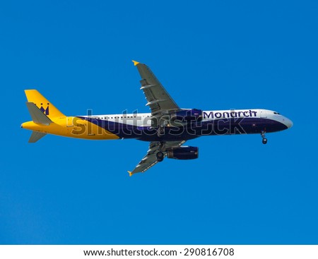 FARO, PORTUGAL - MAY 09 : Monarch Flights aeroplane lands at Faro International Airport, on May 09, 2015 in Faro, Portugal. Monarch is a British airline with 32 jet airliners
