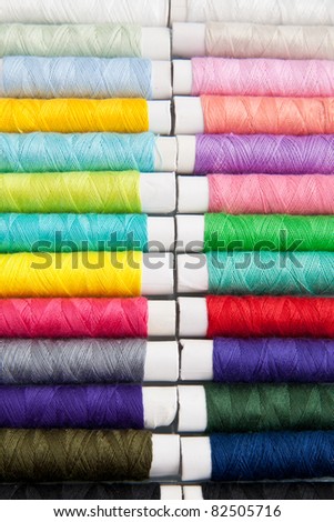 Colored threads for sewing machine, hand sewing, or repair of dresses.