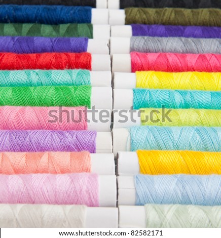 Colored threads for sewing machine, hand sewing, or repair of dresses.