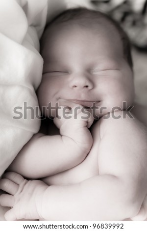 Beautiful one week old baby boy a sleep. Black and White image of resting baby boy