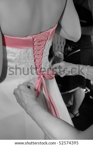 stock photo Pink knot on wedding dress with Black and white