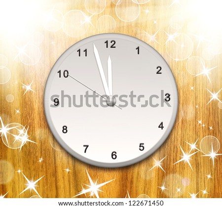 Clock on the wood texture showing 12 o'clock with bright light and many stars and bokeh. Christmas background