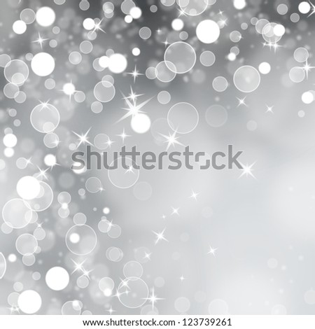 Grey abstract Christmas background with stars and bokeh