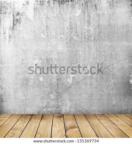 empty interior of vintage room with grey grunge stone wall and old wooden floor.