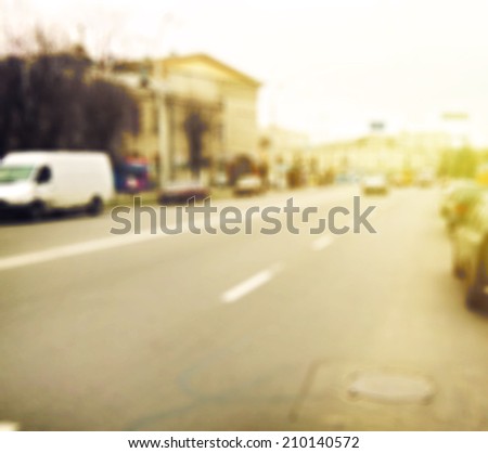 Vintage city street background with road and cars on background