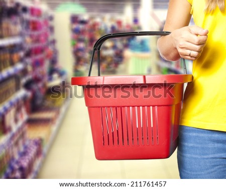 Women  holding empty shopping basket - Shopping concept