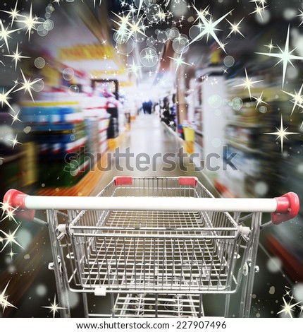 Shopping in supermarket. Shoping cart with christmas lights