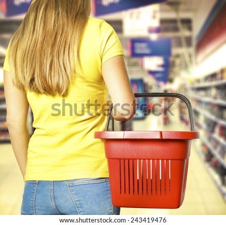 Women holding empty shopping basket - Shopping concept