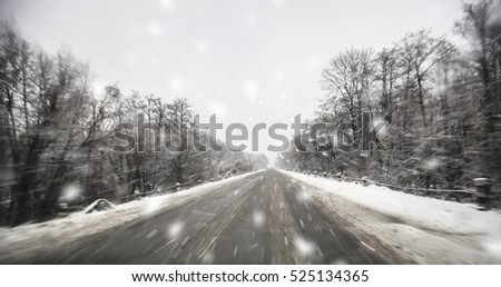 Blurred winter asphalt road