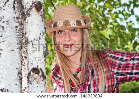 one girl on the nature dressed in western style