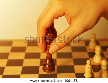 A photo of a woman playing chess