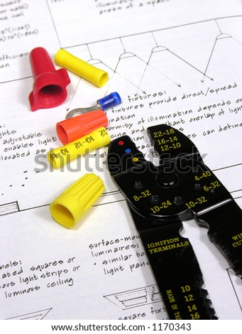 A photo of wire joiners/caps and a wire stripper with an electrician theme