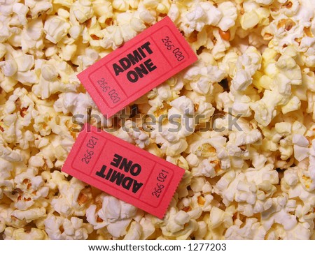 A photo of movie tickets on popcorn