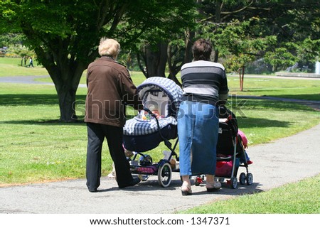 Mothers pushing their babies through the park