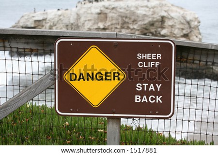 Danger sign at the cliff\'s edge
