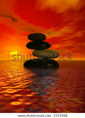 Balanced rocks in the ocean at sunset