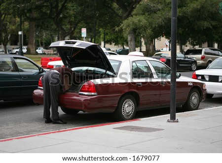 Cab driver loading the trunk