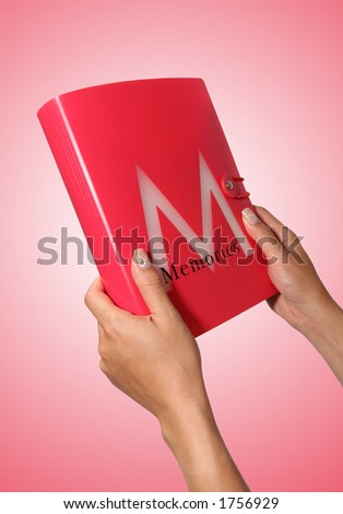 A girl holding a memory book