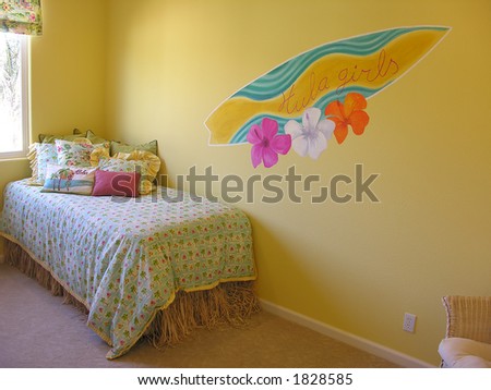 A hawaiian themed bedroom with a surfboard painted on the wall