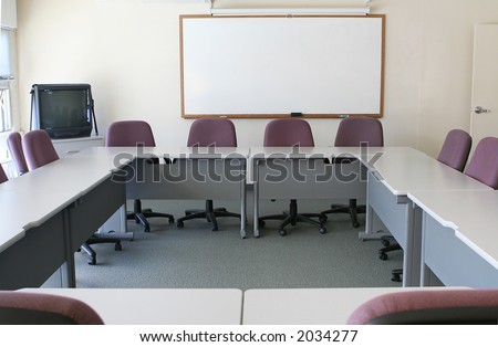 A conference room with the tables arranged to form a square