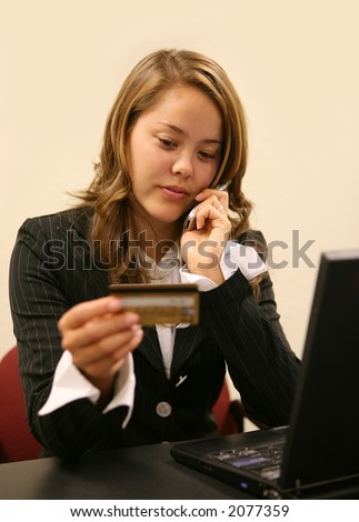 A woman placing an order with her credit card online