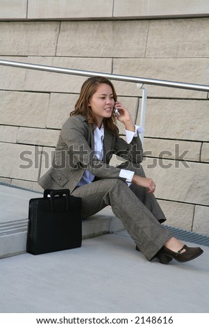 A business woman on the phone talking to clients