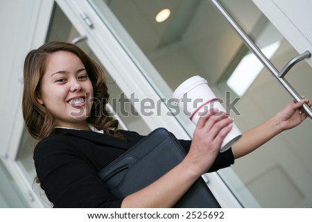A business woman starting work with her coffee