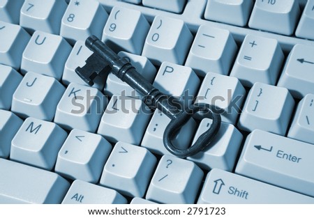 An old skeleton key on a computer keyboard